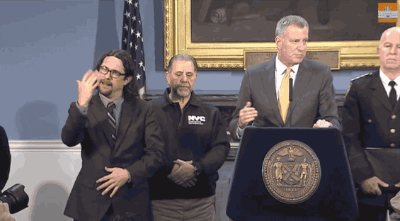  Jonathan Lamberton interpreting New York's mayor, Bill de Blasio's, speech in sign language.